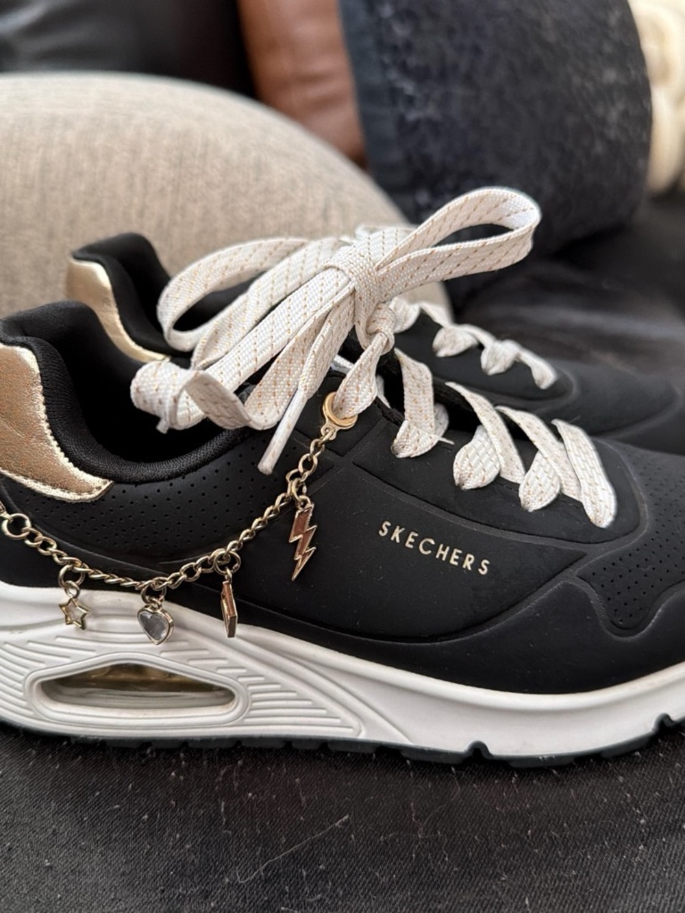 Skechers Women's Black and White Lace-Up Sneakers with Gold Accents